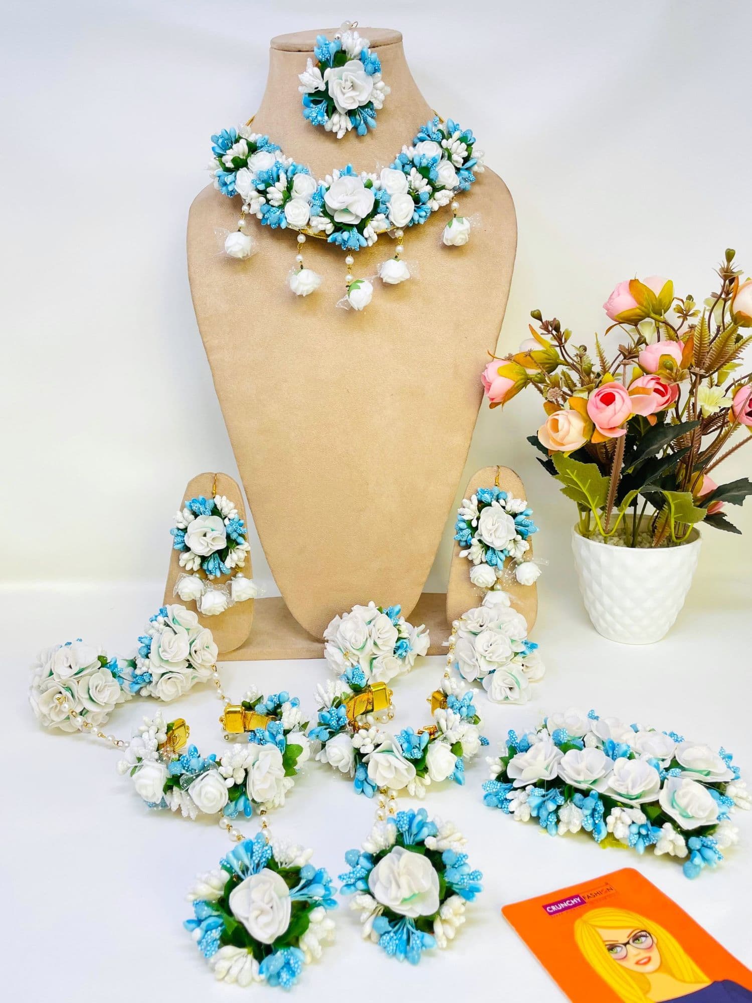 Multicolor traditional handmade flower theme jewellery set, ideal for brides on Haldi and Mehandi occasions. Crafted from beaded pearls with fishhook earring back.